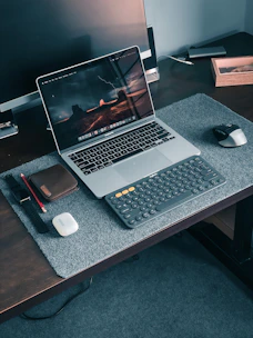 macbook pro on brown wooden table