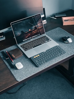 macbook pro on brown wooden table