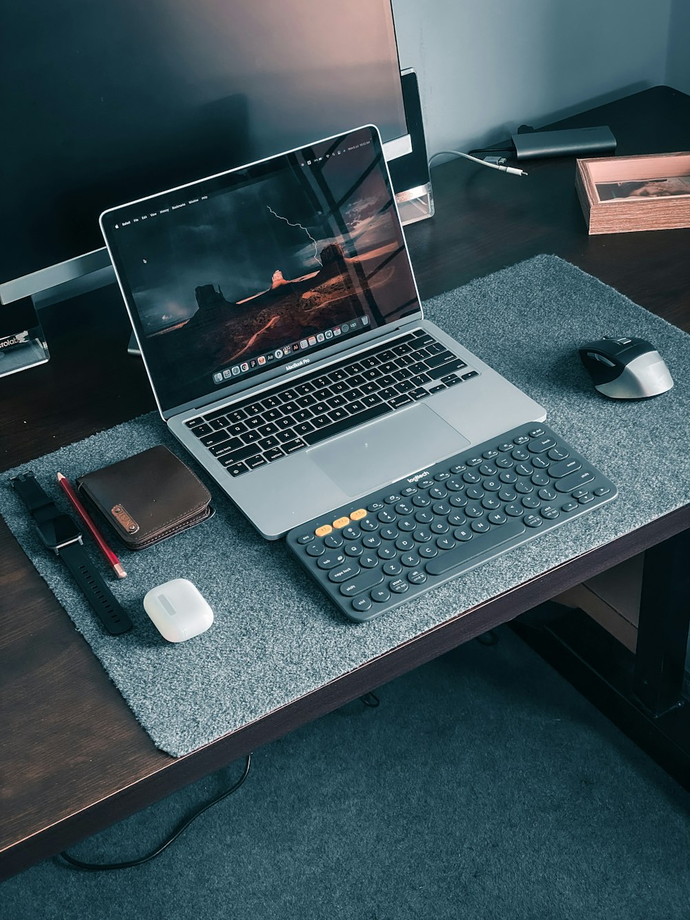 macbook pro on brown wooden table