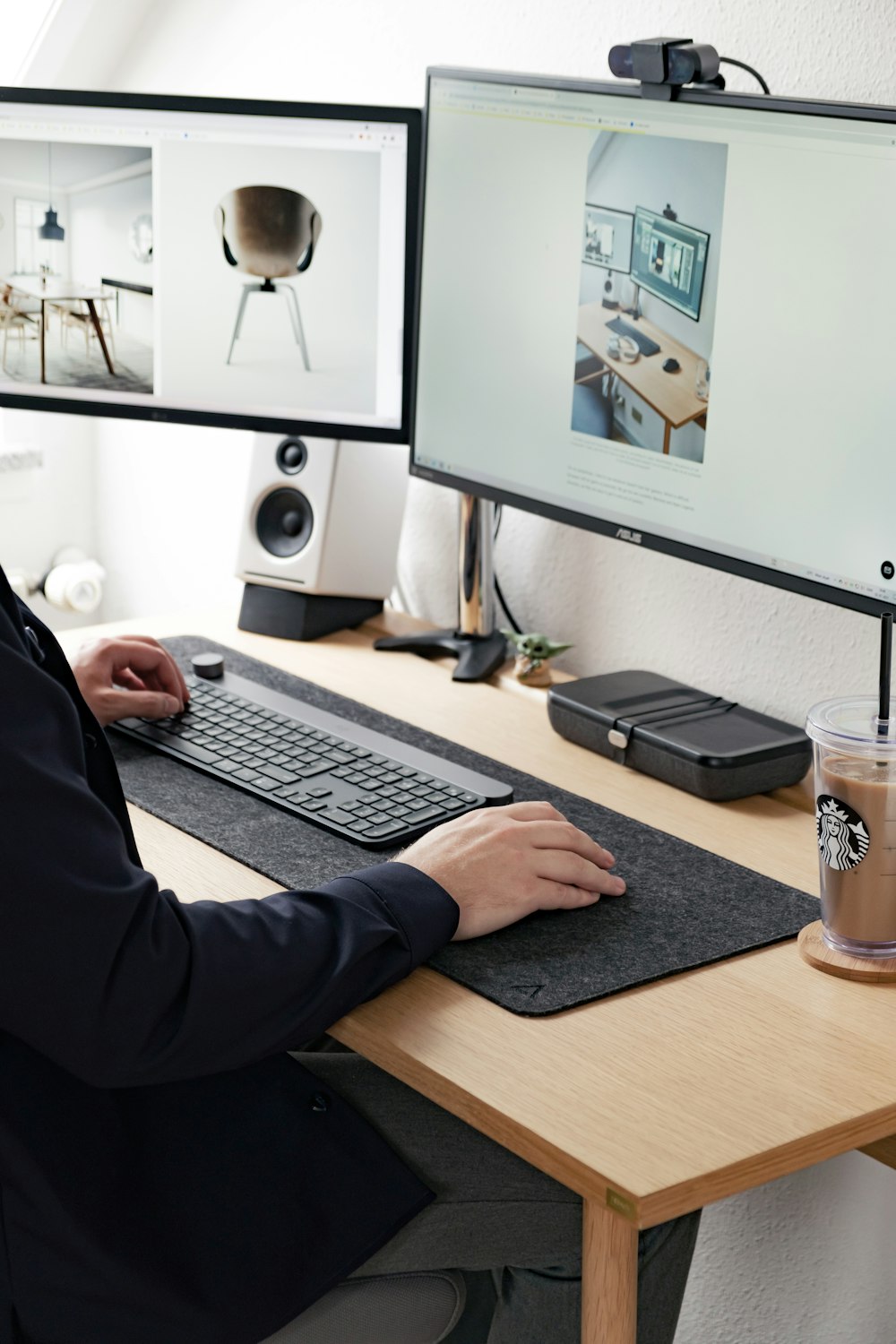 man in black long sleeve shirt using computer