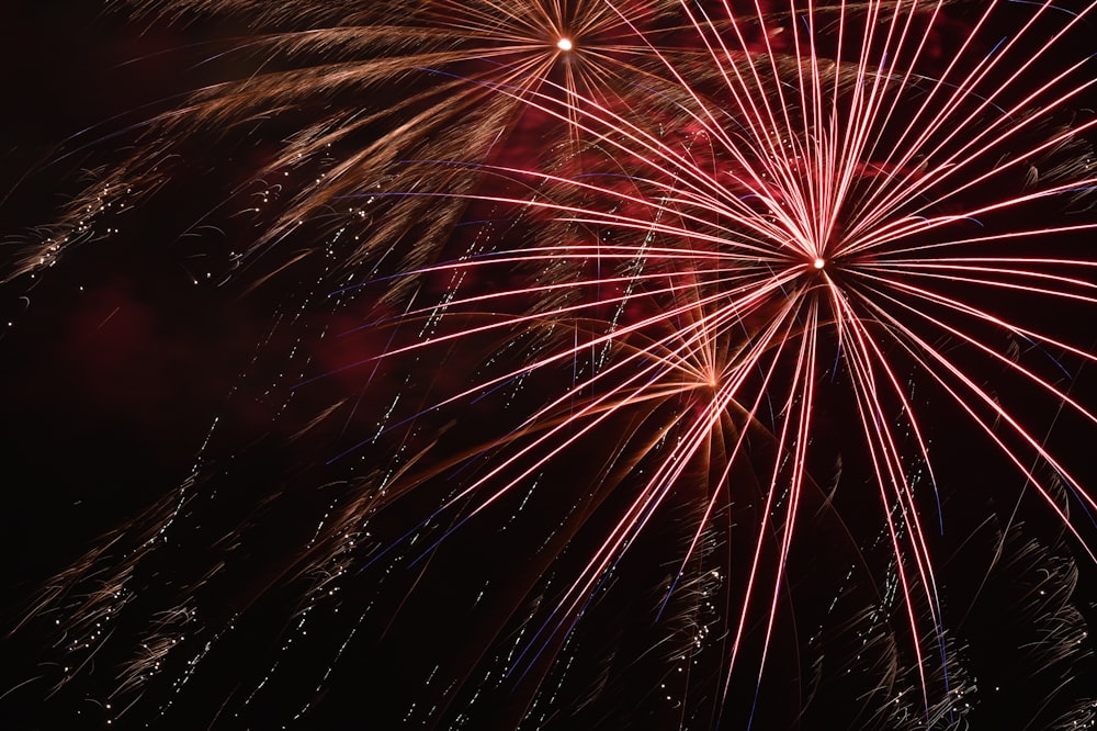 red and yellow fireworks during night time