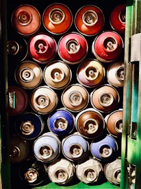 Close-up of cans of high-quality primers and industrial paints neatly arranged.