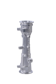 A metallic, cylindrical component with multiple protrusions and flanges. It has a polished, silver finish and is potentially a part of a machine or industrial equipment.
