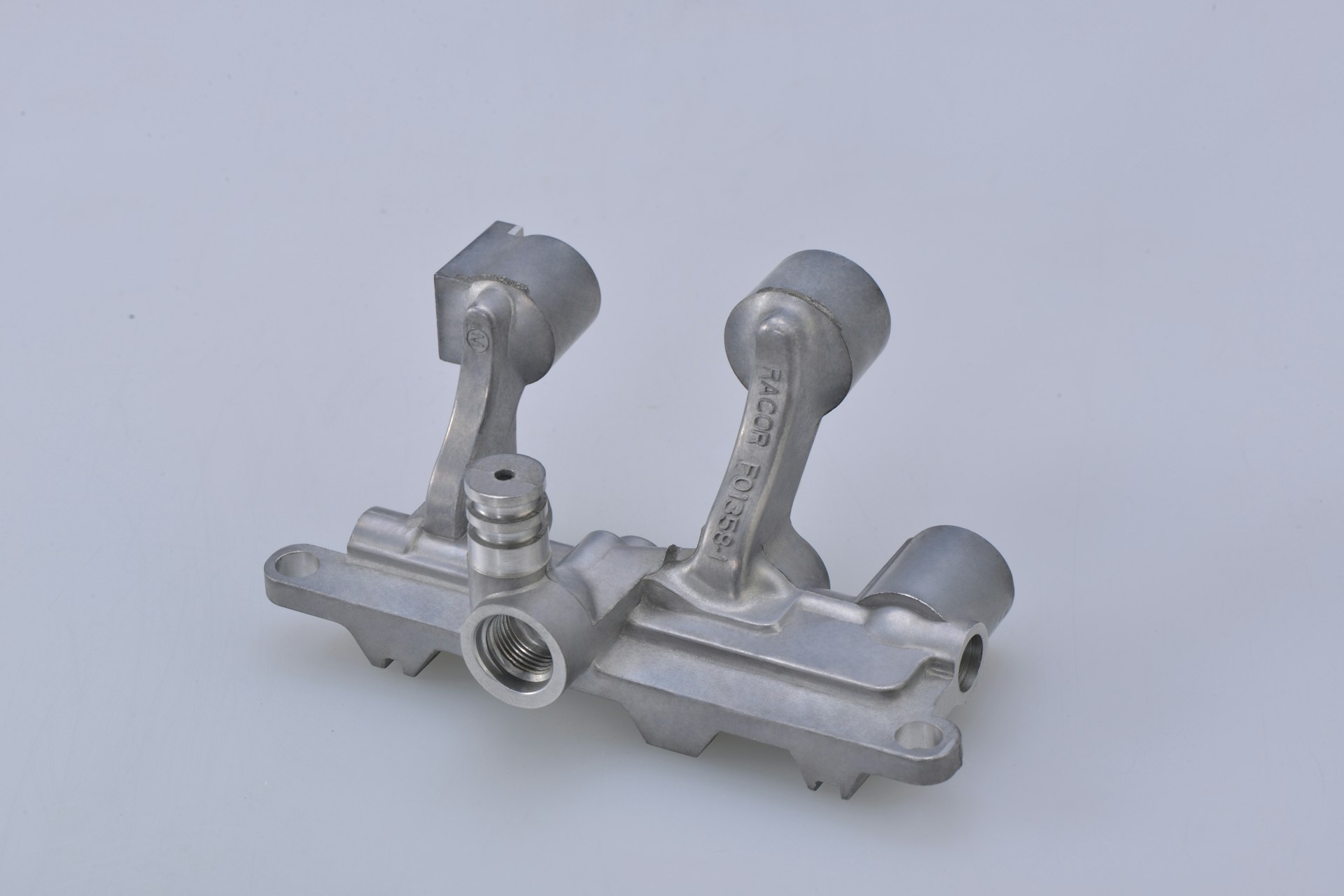 gray metal tool on white surface