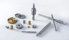 silver screw driver and round gold coins