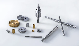silver screw driver and round gold coins