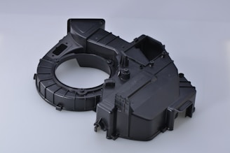 black plastic toy on white surface