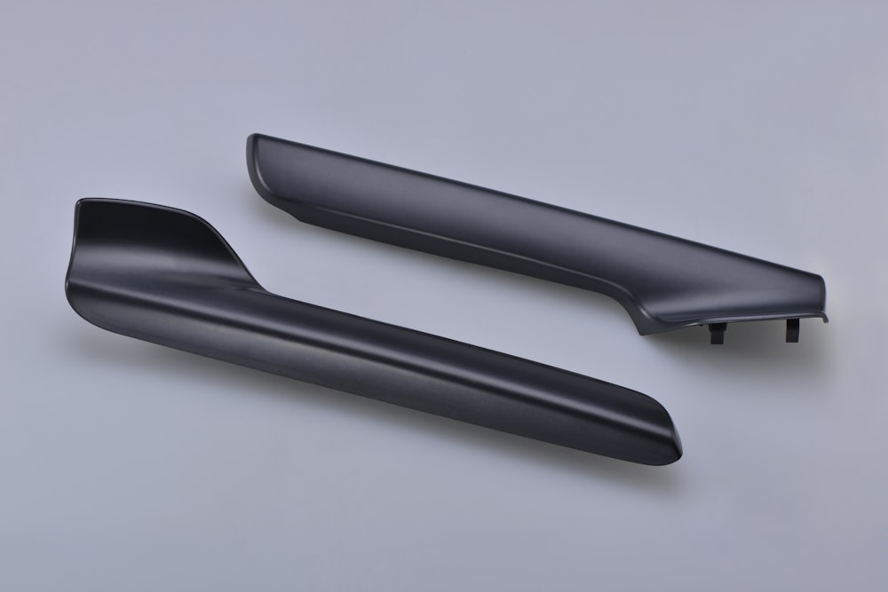 black plastic tool on white surface