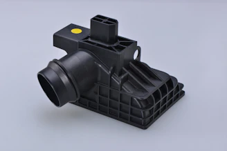 black dslr camera on black plastic rack
