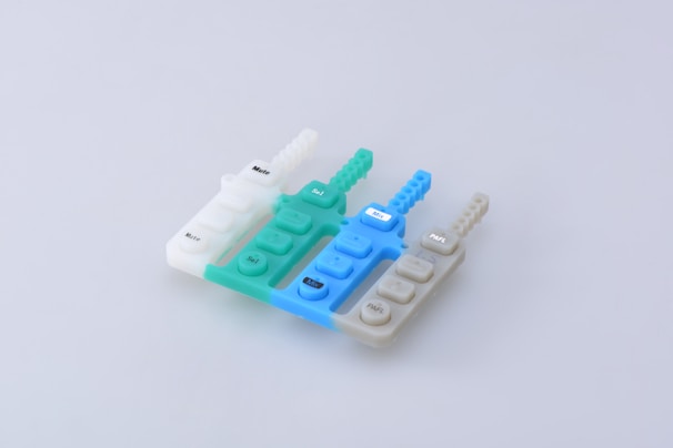 white and blue plastic lego blocks