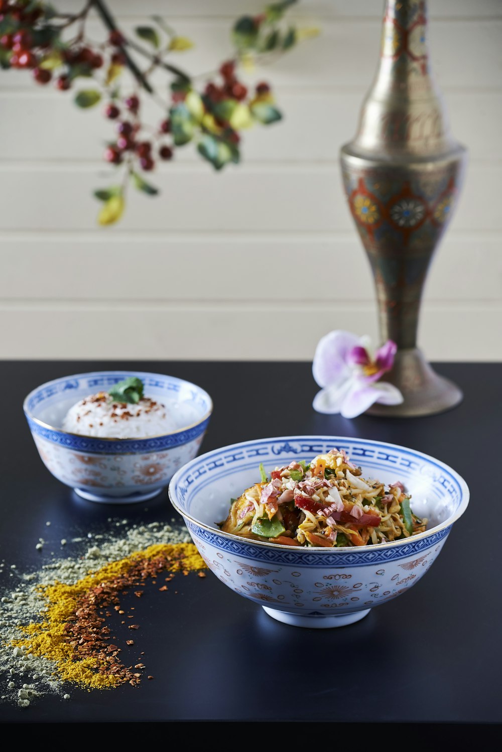 white and blue ceramic bowl with food