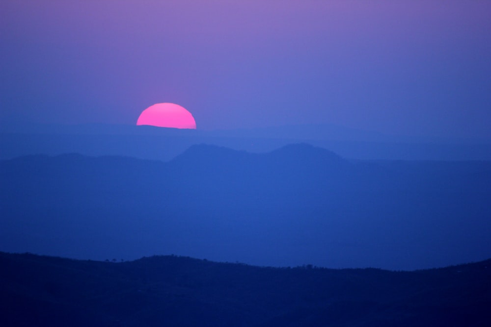 silhouette of mountains during sunset