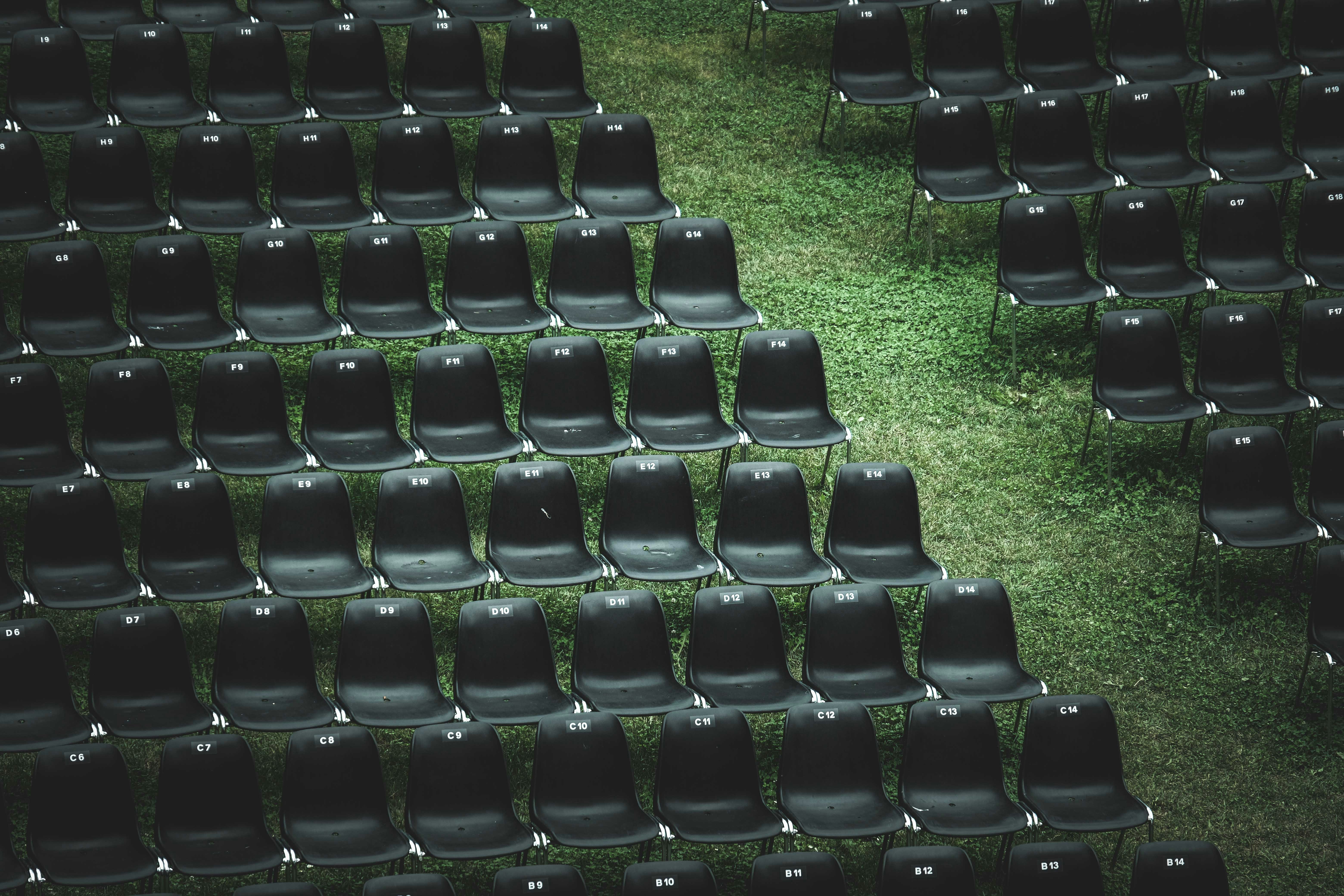 black chairs on green grass field