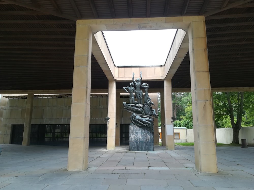 black statue of man in black suit