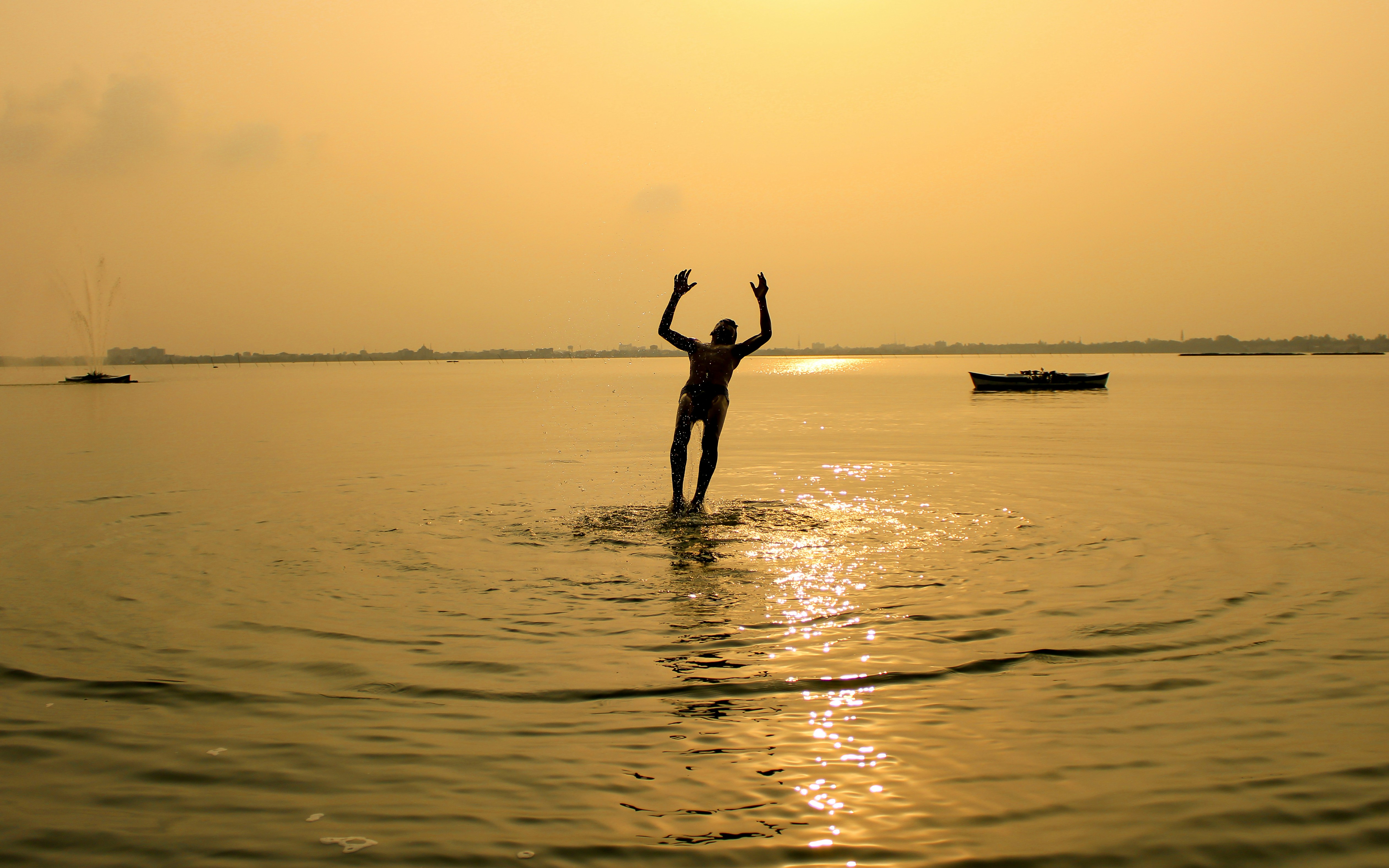 silhouette of 2 person on beach during sunset