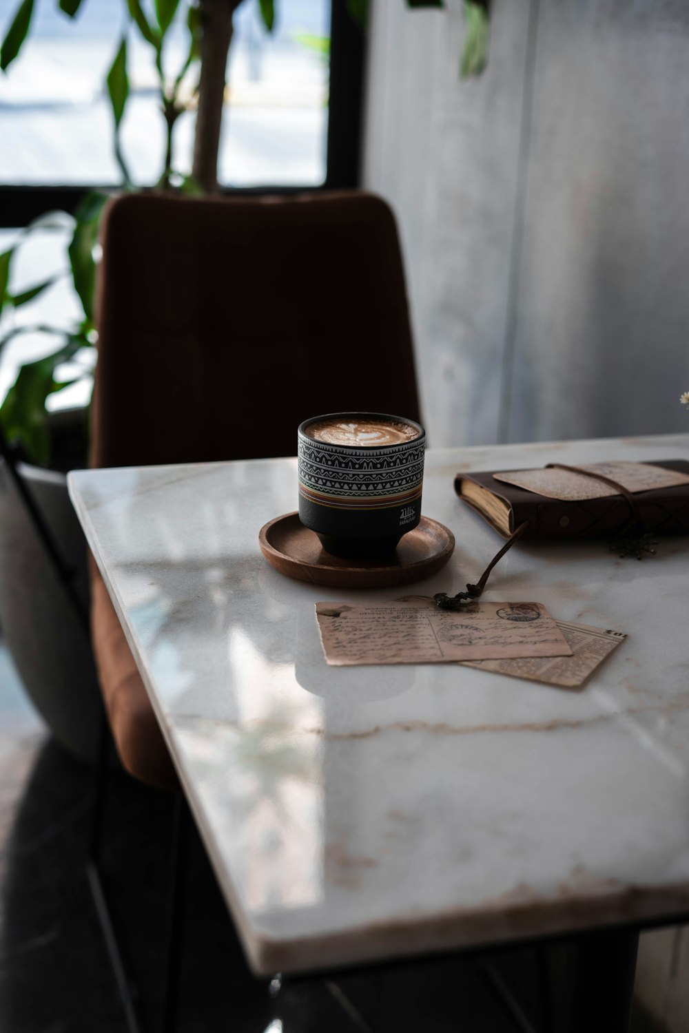 black and white coffee cup on brown wooden table