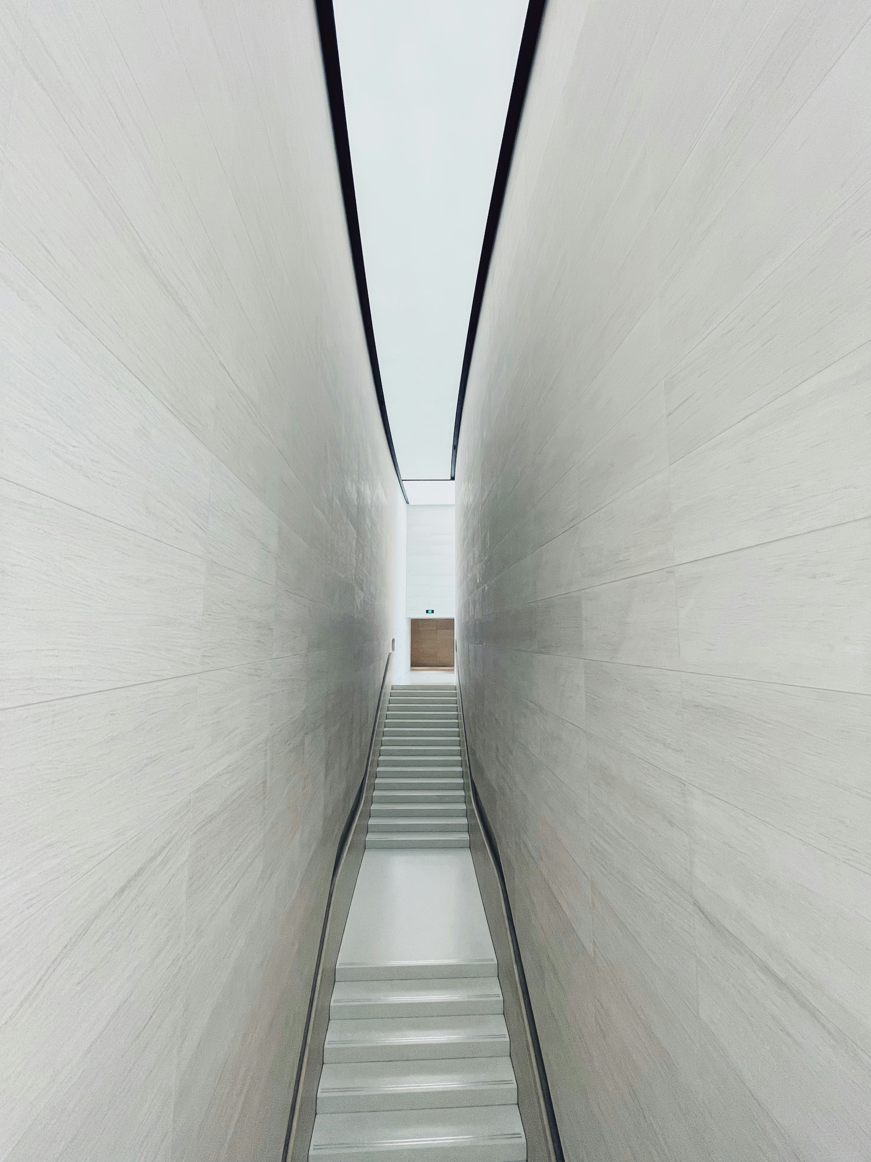 white concrete hallway with white ceiling