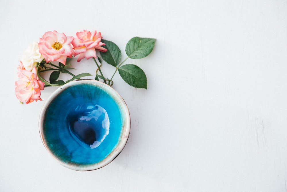 blue and white ceramic bowl with pink flowers