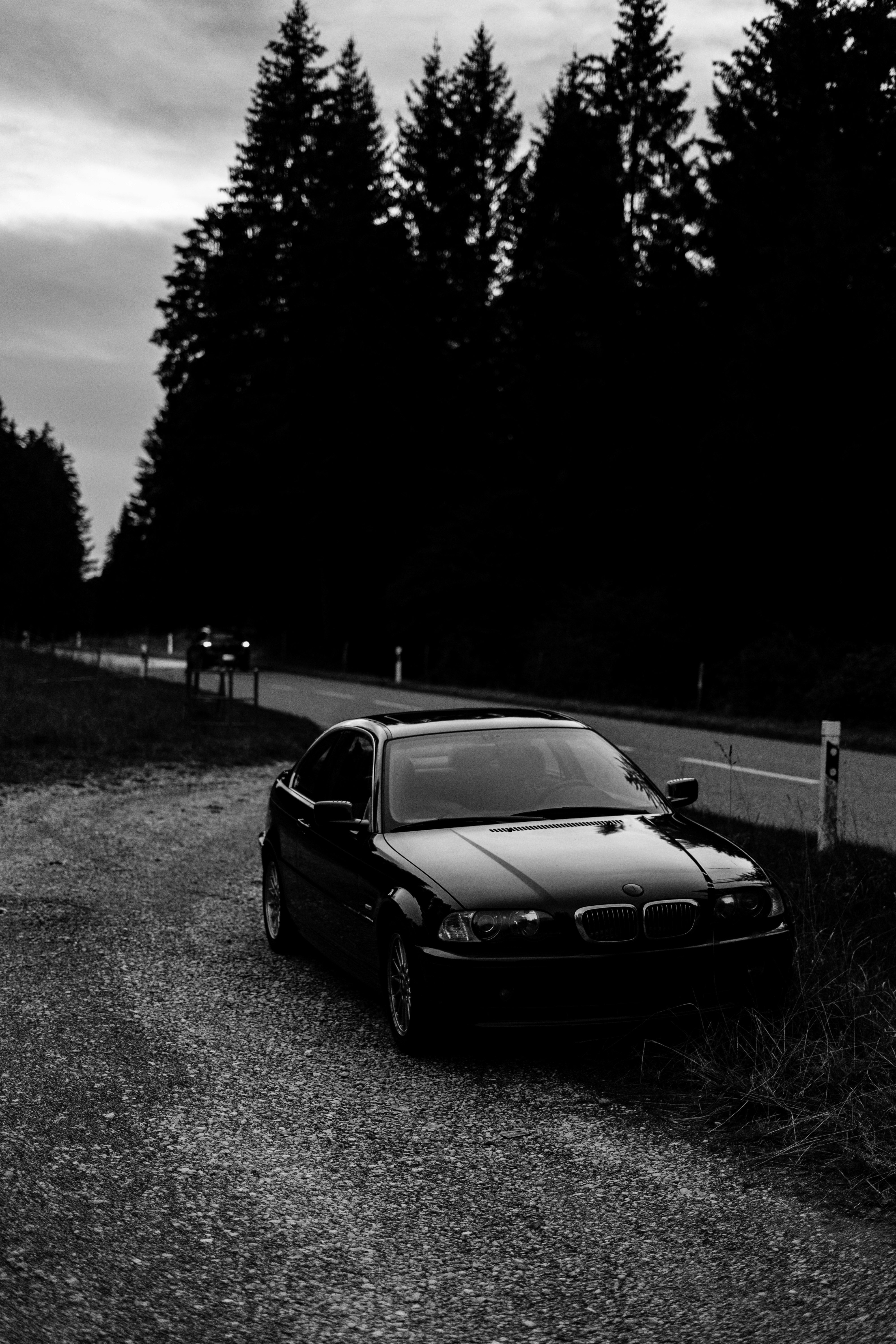 grayscale photo of bmw m 3 coupe on road