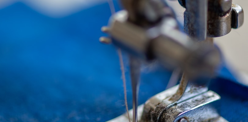 blue and silver sewing machine