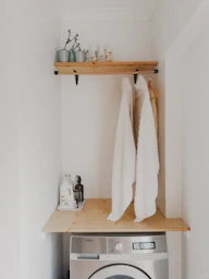 white bath towel on brown wooden table