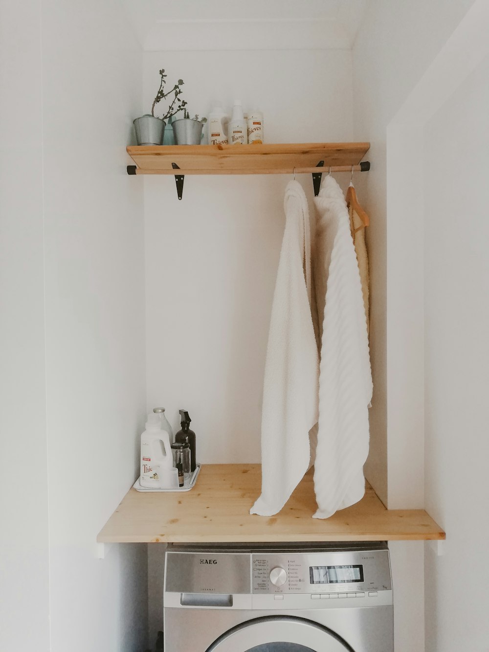 white bath towel on brown wooden table