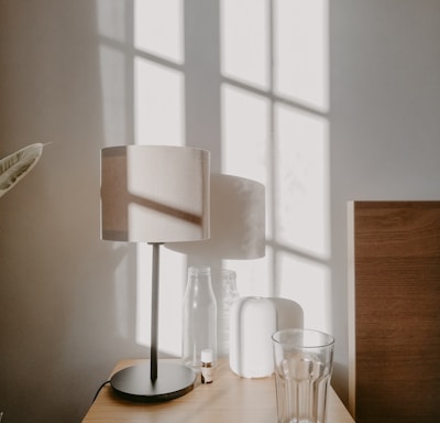 white table lamp on brown wooden table