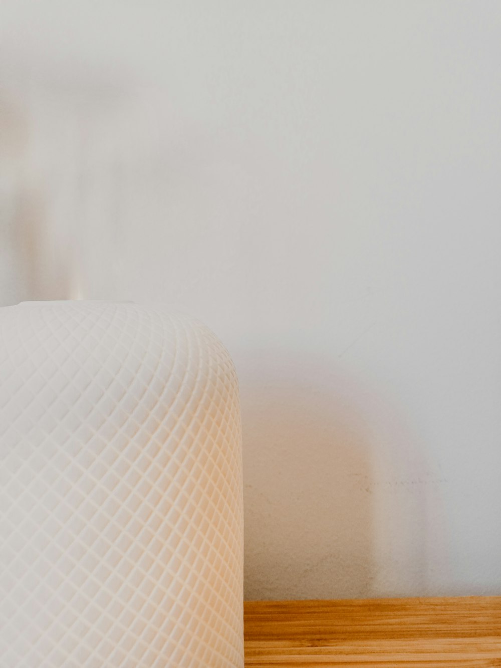 white toilet paper roll on brown wooden table