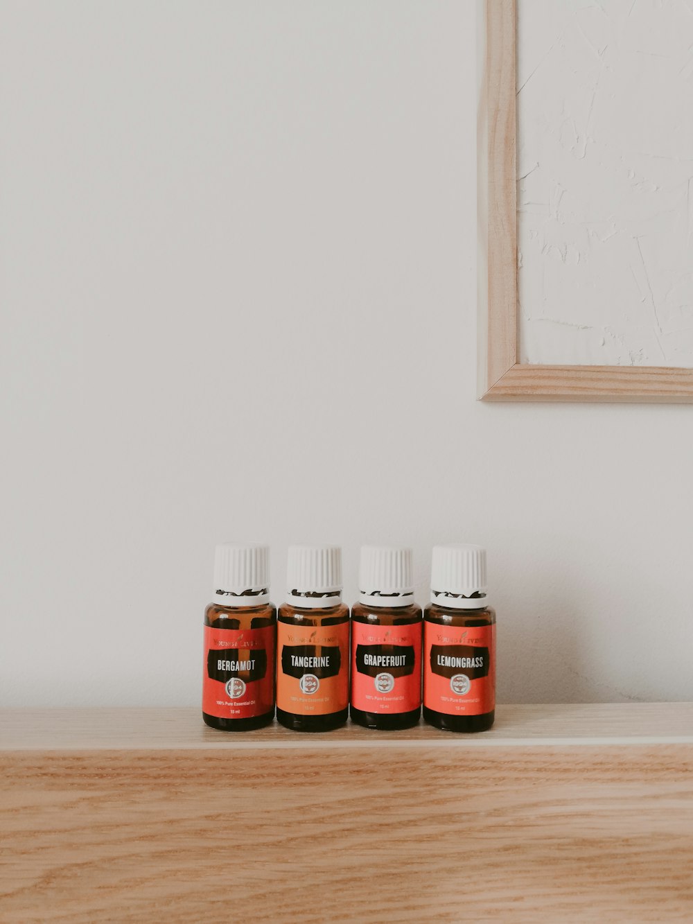 three red and white condiment shakers on brown wooden table