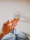 person holding white medication pill