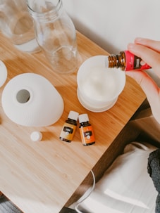 person holding white and orange bottle