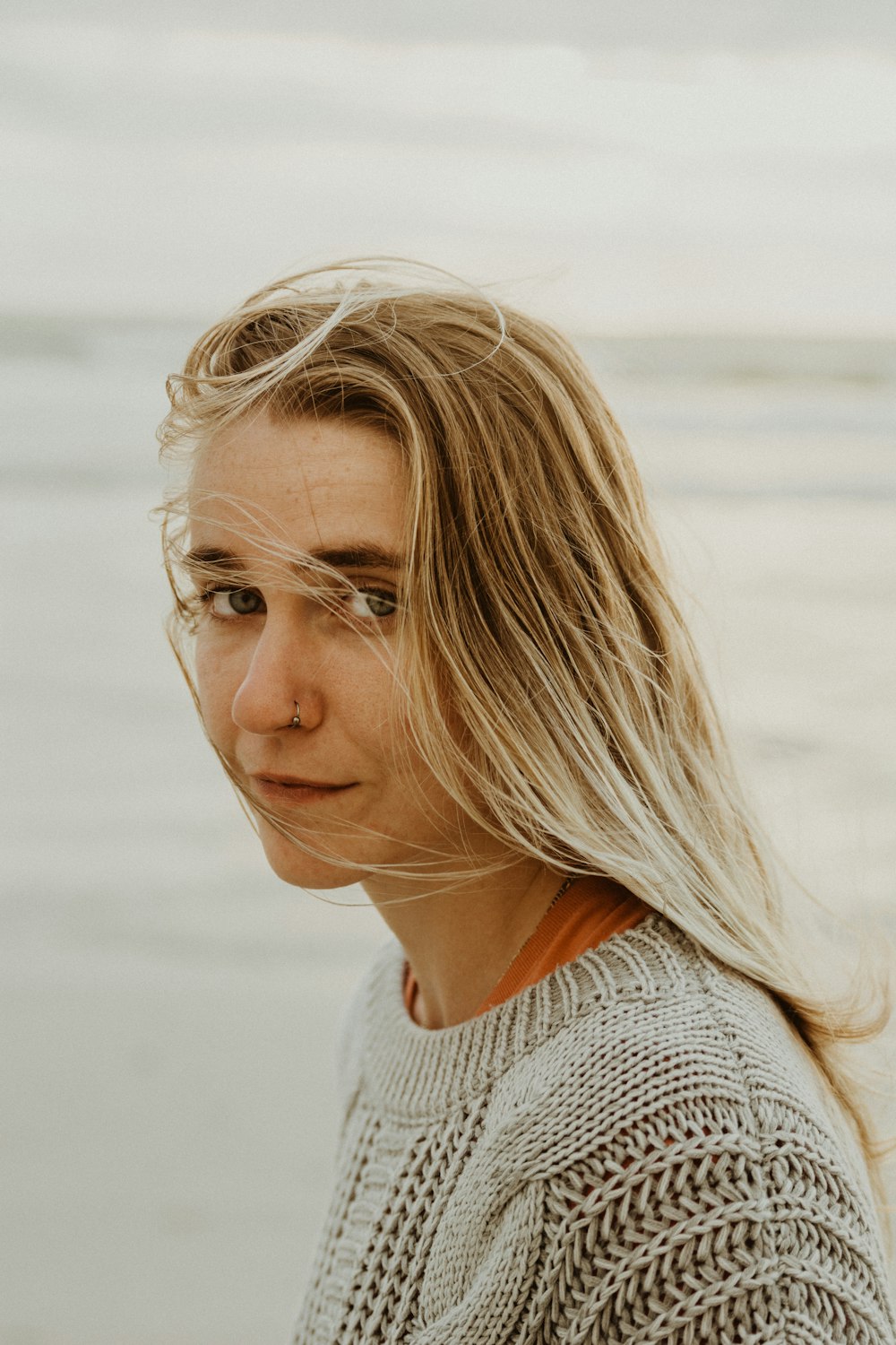 woman in gray knit shirt