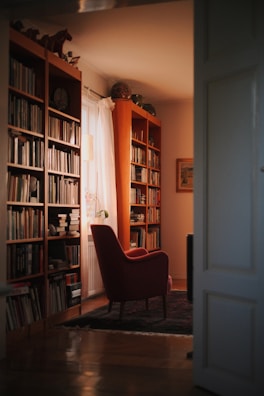 A cozy reading nook with soft blue and white cushions and natural light.