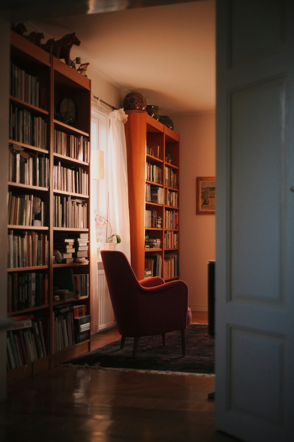 brown wooden shelf near white wooden door