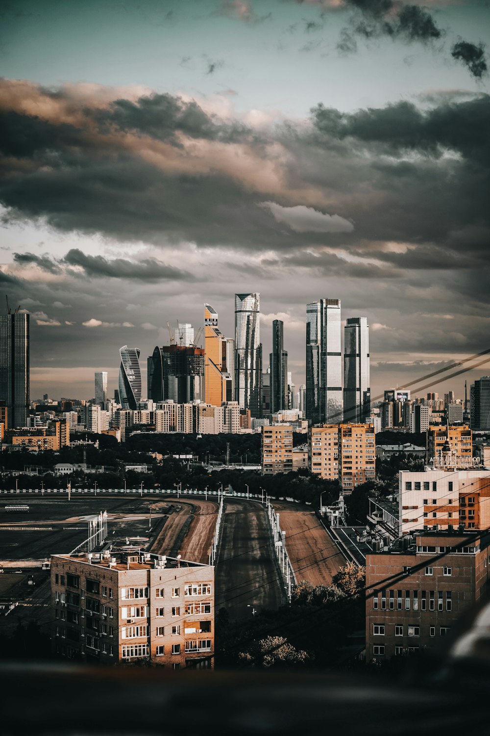 city buildings under gray cloudy sky during daytime