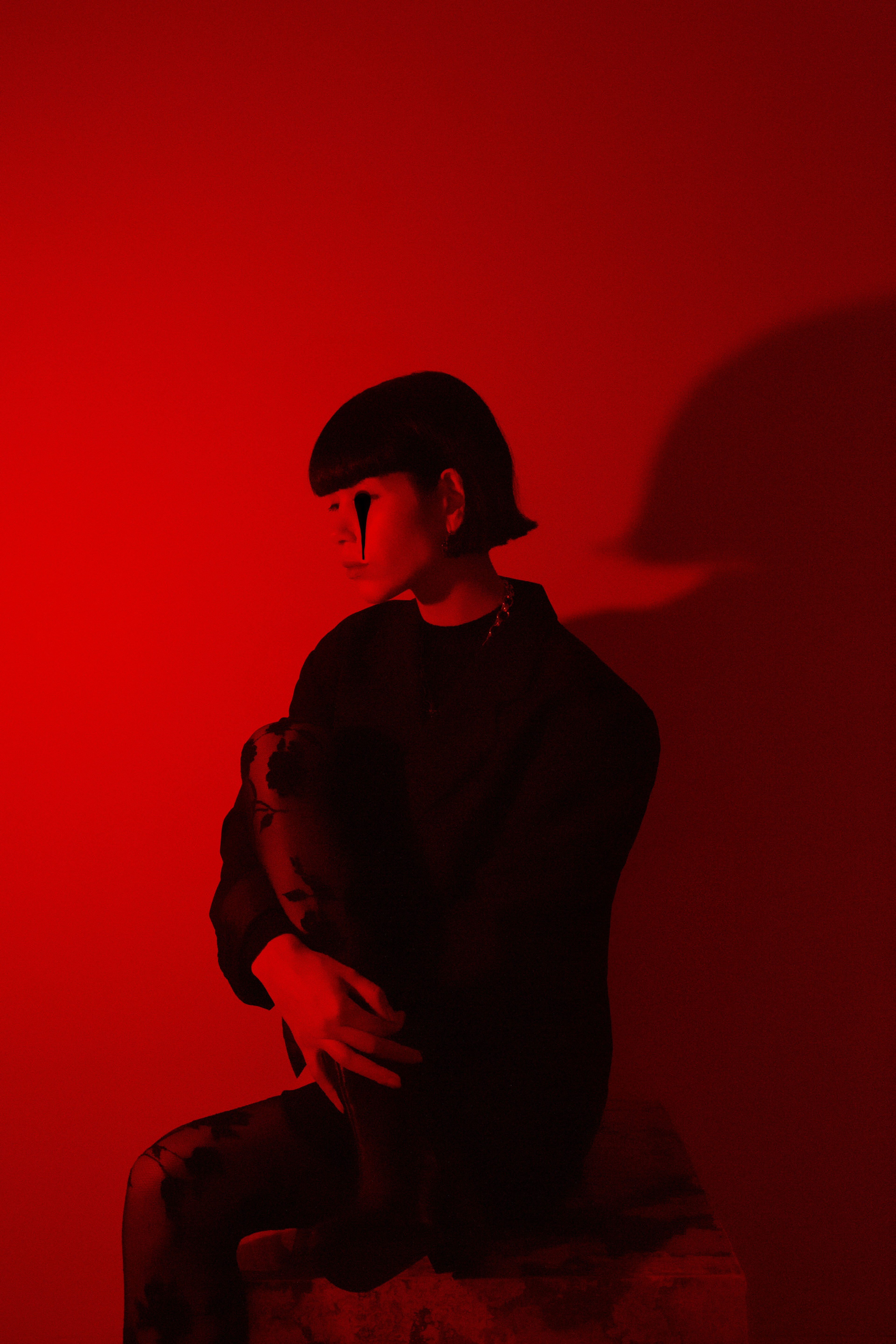 man in black jacket and black hat