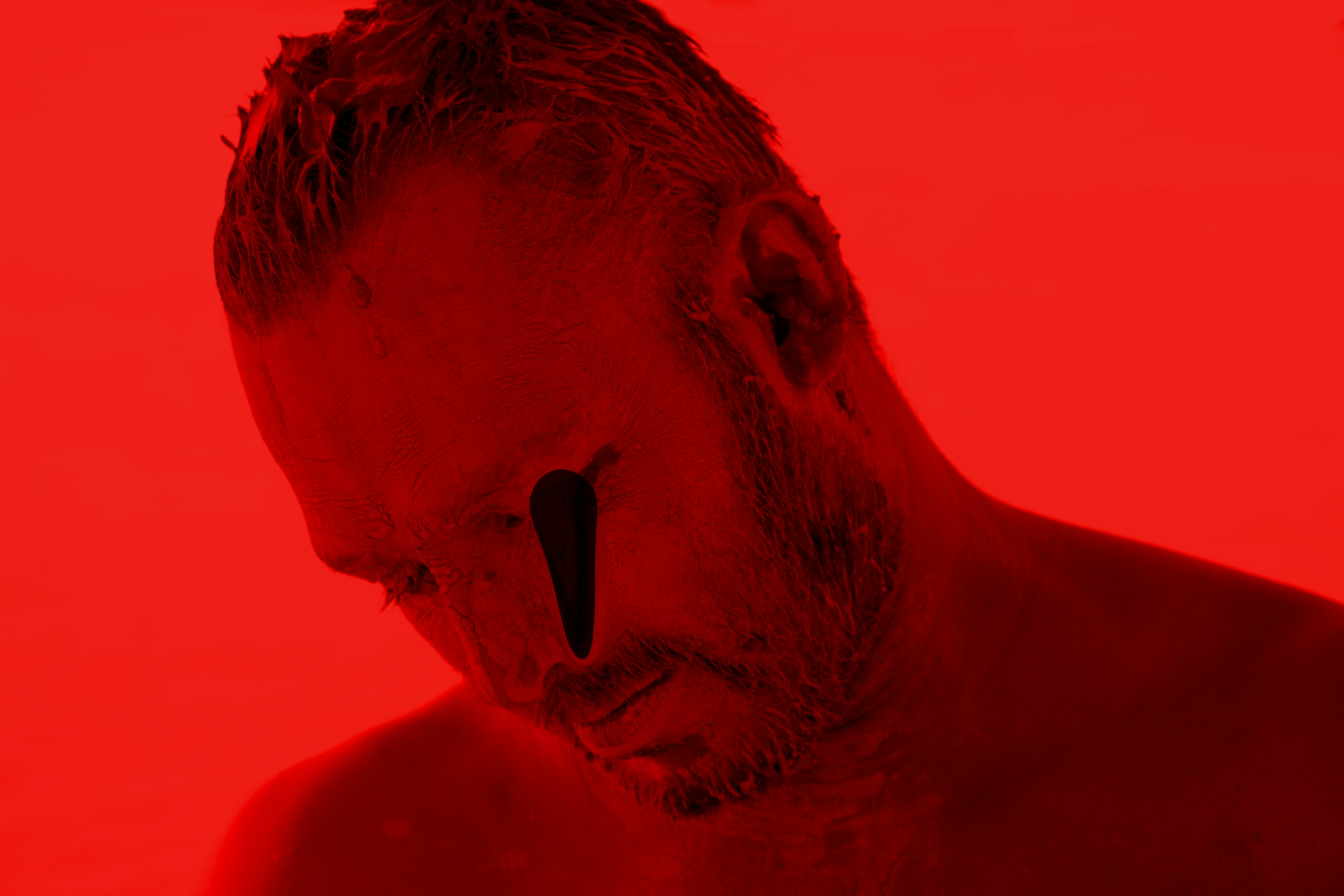 man with black hair and mustache