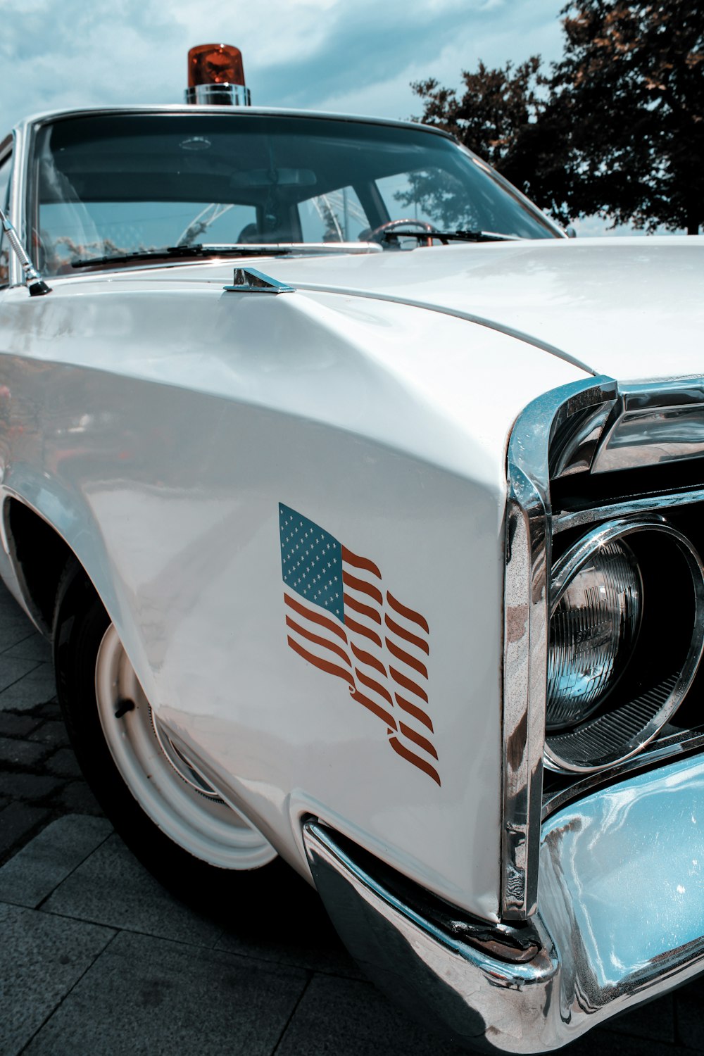 white and blue chevrolet car