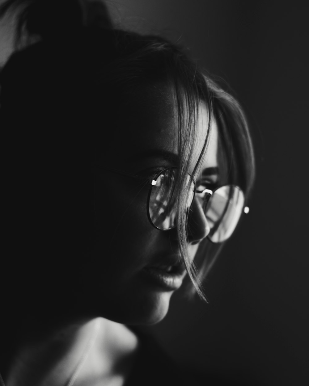 woman wearing silver framed eyeglasses