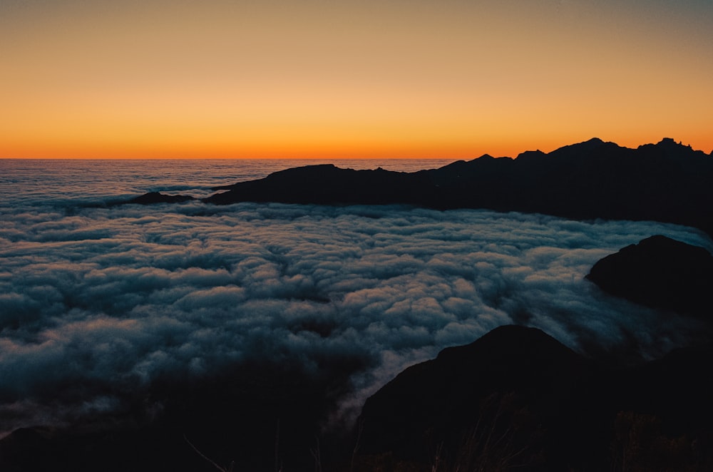 sea of clouds during sunset