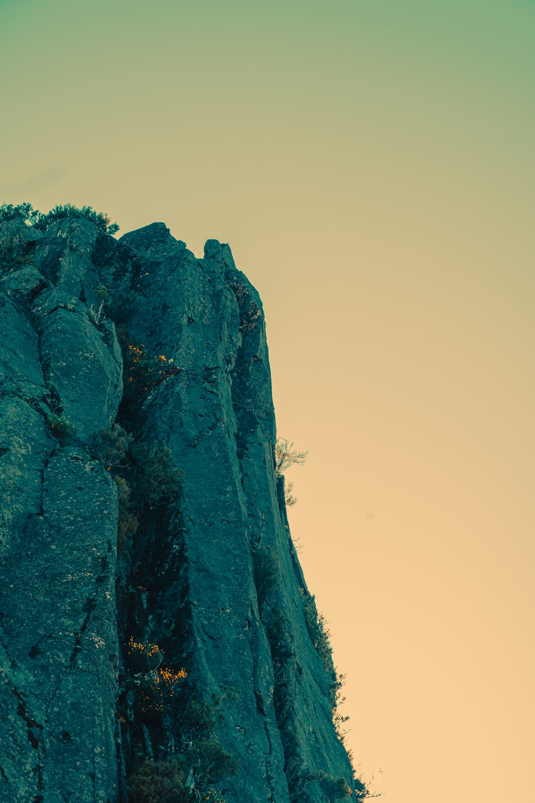 green and brown rock formation