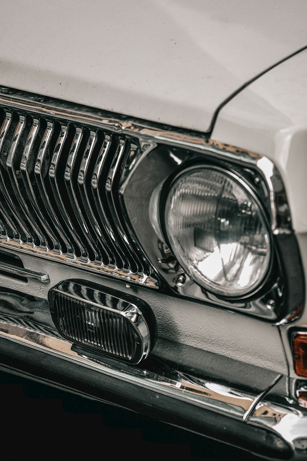 white and silver car with headlight