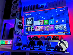 A vibrant gaming setup with consoles and games.