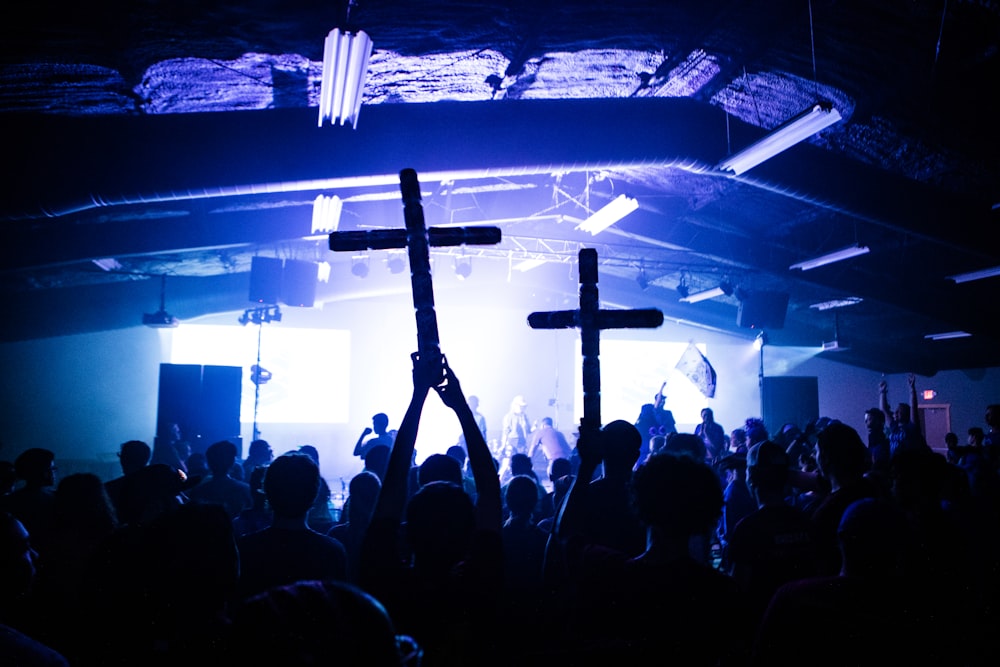 people standing on stage during night time