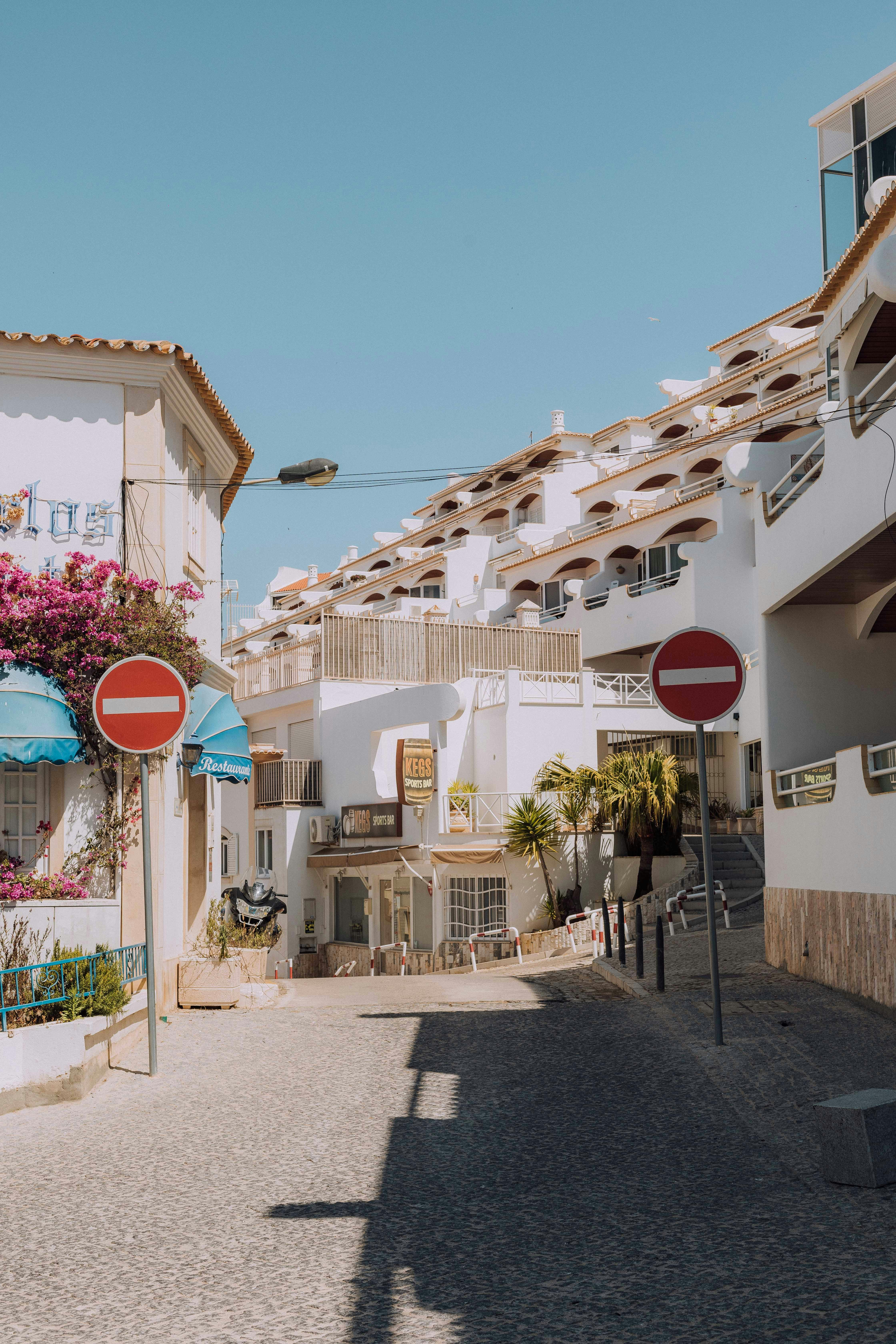 white and brown concrete building under blue sky during daytime