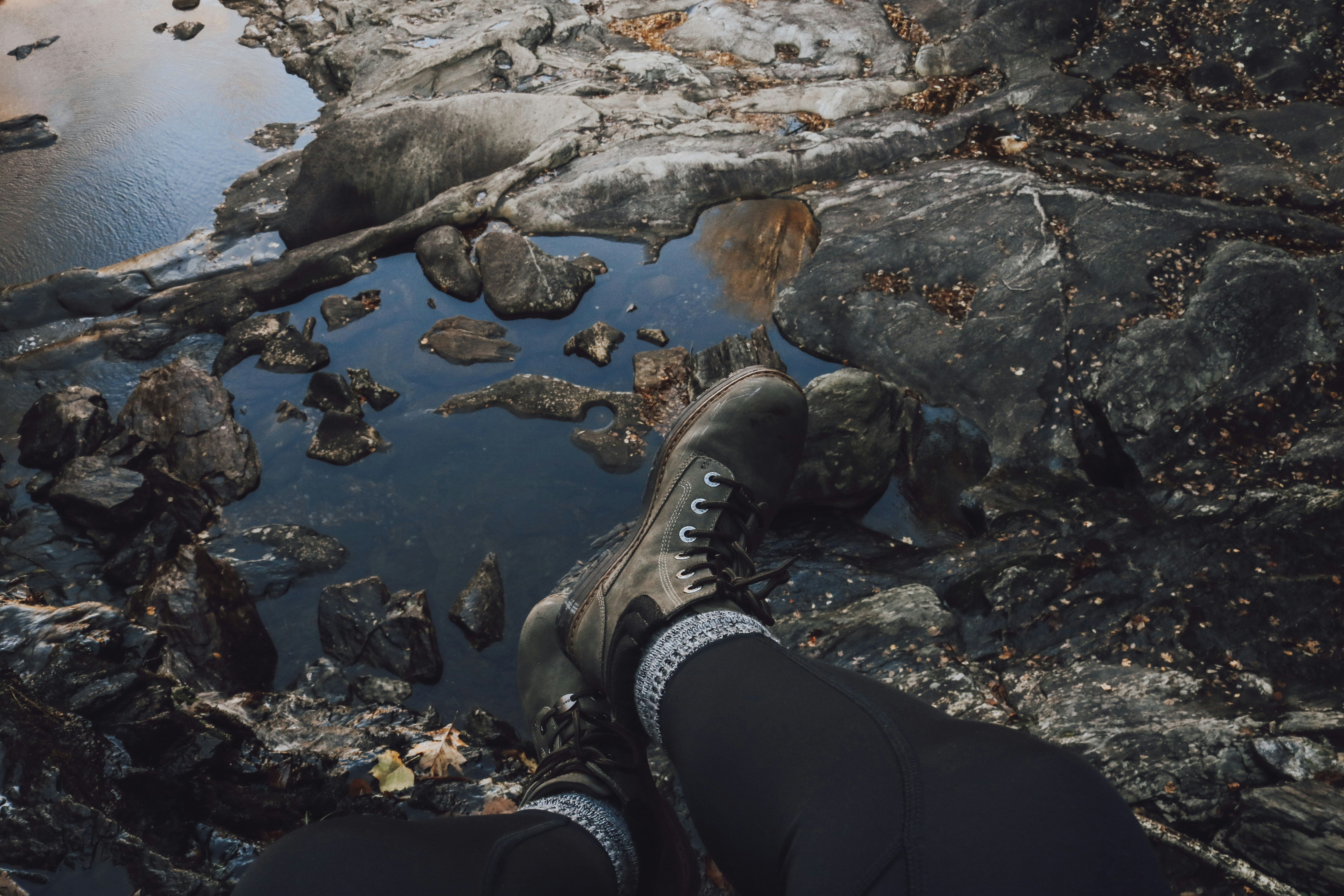 hiker resting at stream