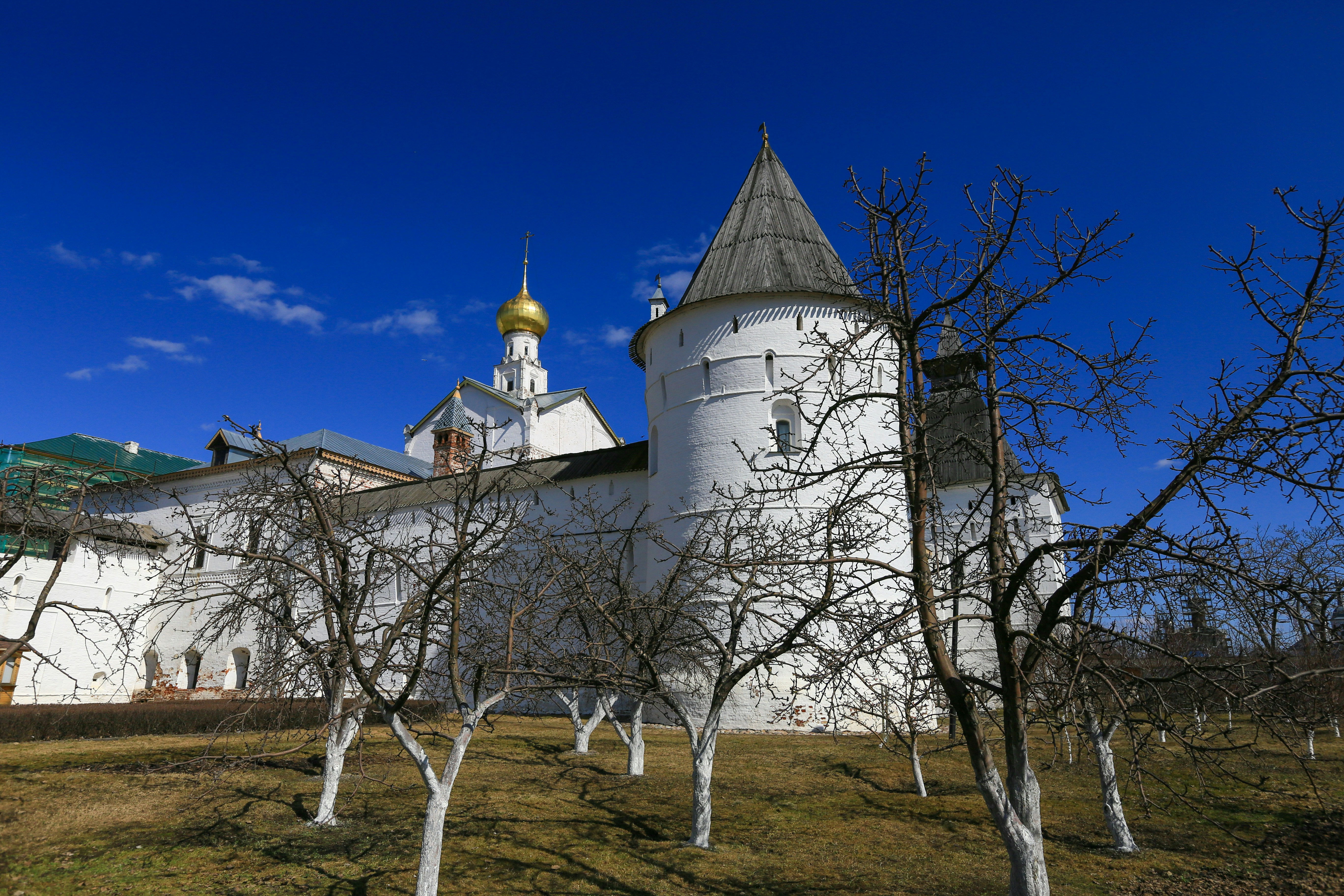 white and brown concrete building under blue sky during daytime