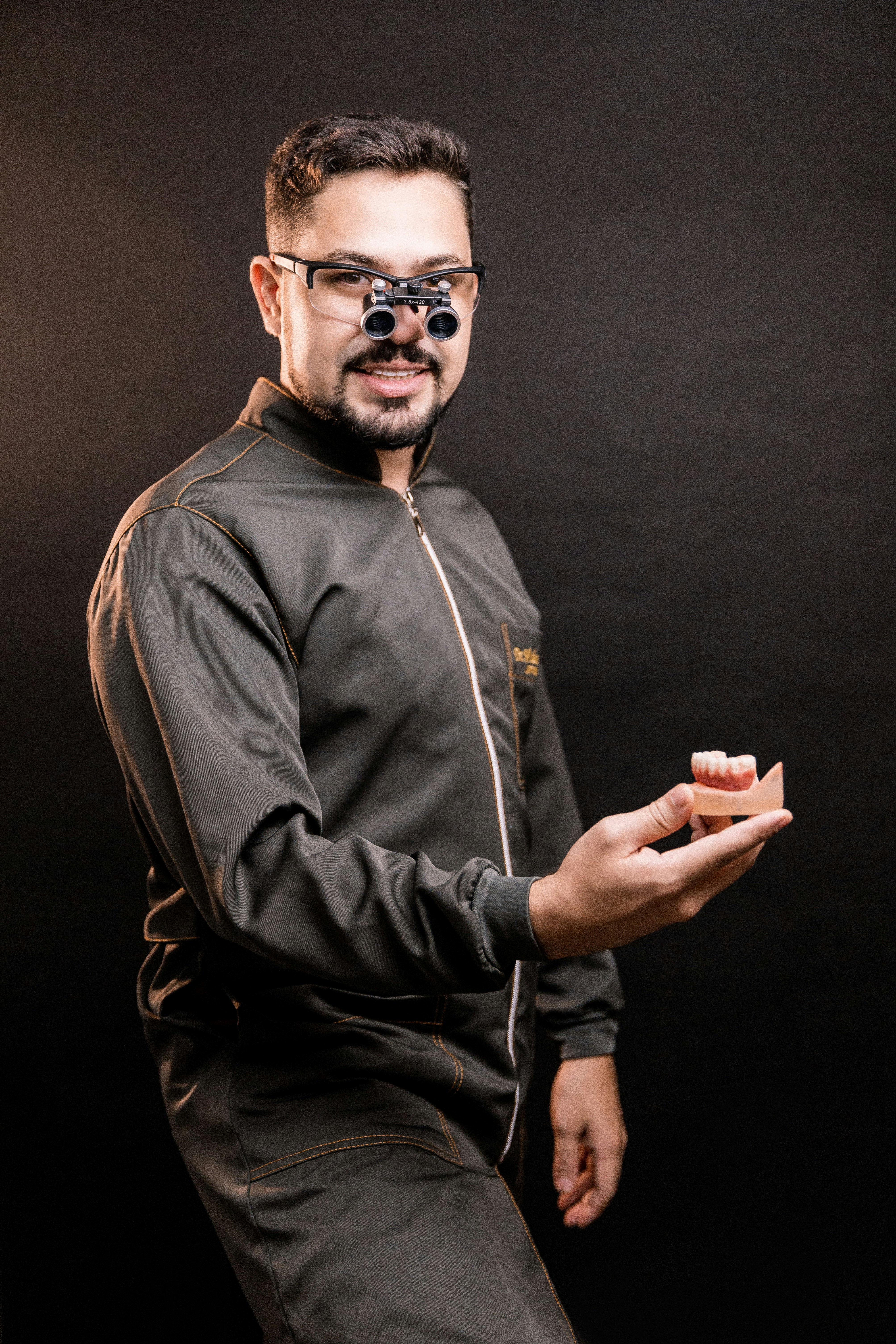 man in black leather jacket wearing black framed eyeglasses