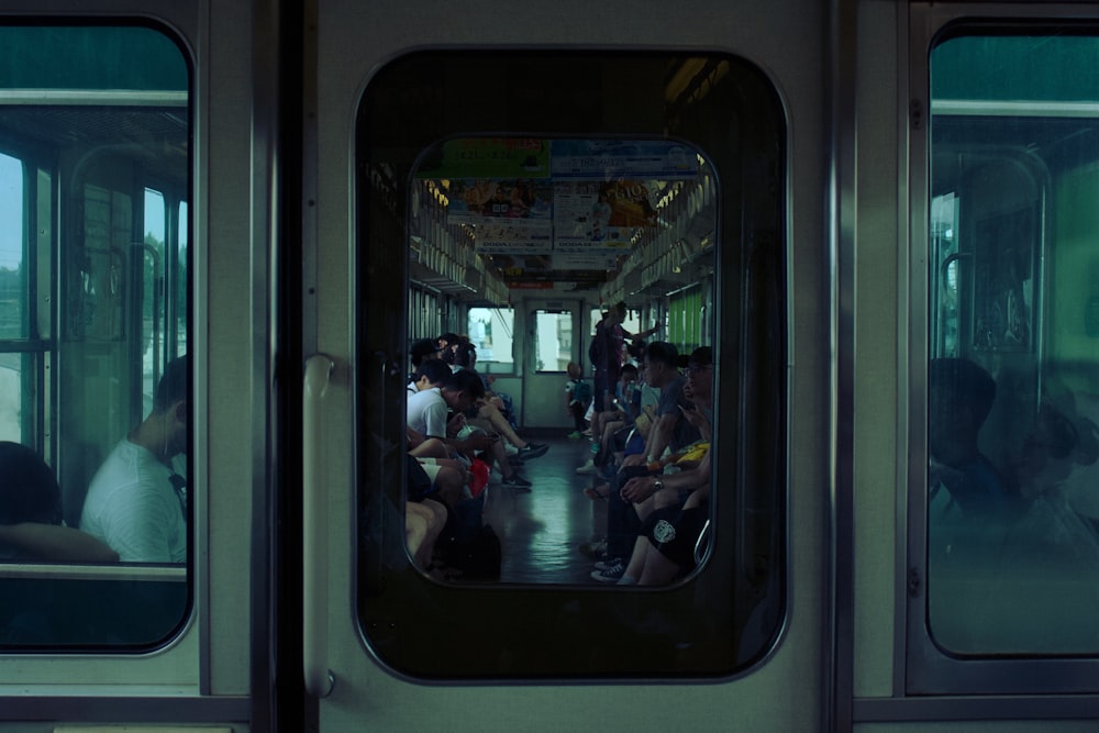 people sitting inside train during daytime