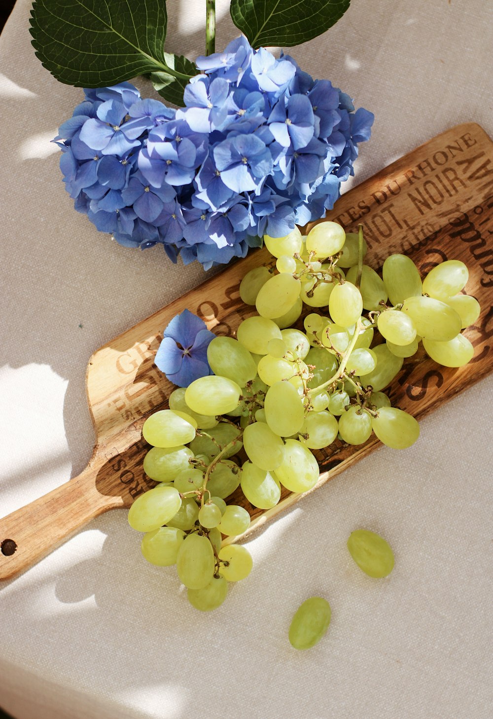 green grapes on brown wooden spoon